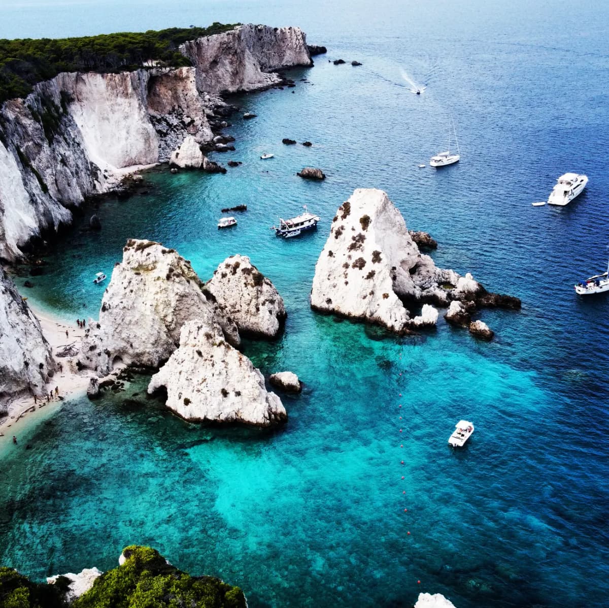 A breathtaking aerial view of San Nicola di Tremiti's rocky coastline with turquoise waters in Apulia, Italy.