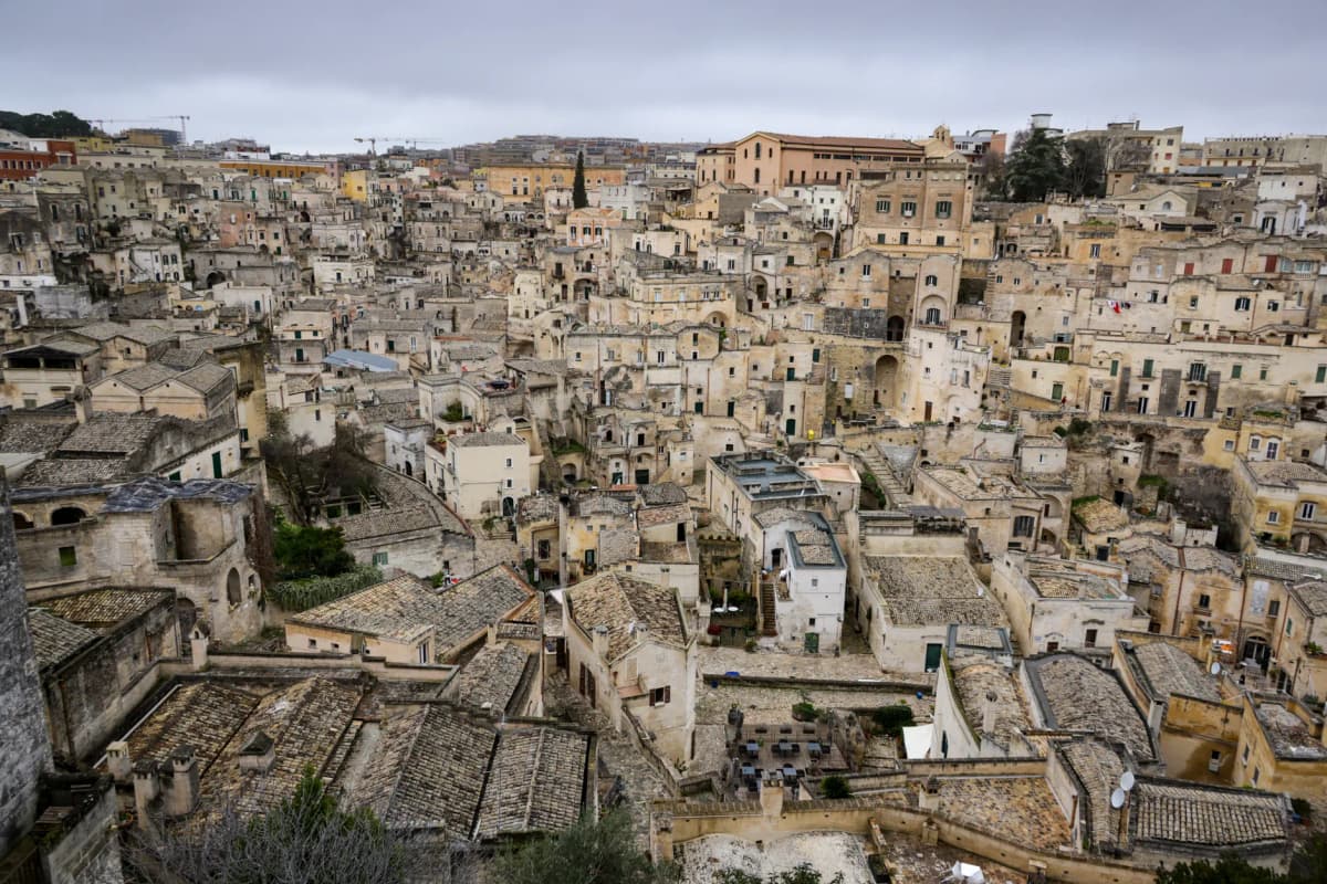 Aerial view of the ancient stone buildings in Matera, showcasing historic Italian architecture.